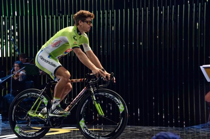 Peter Sagan rides into the team presentation on a custom painted bike
