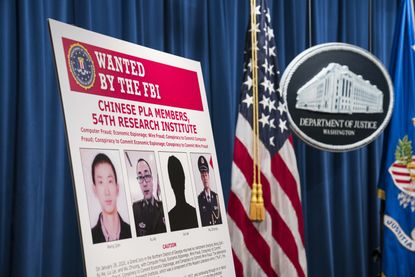 A sign showing people wanted by FBI