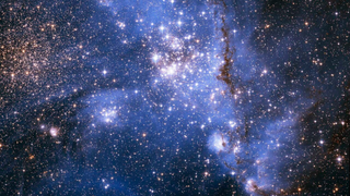 Densely packed stars and glowing gas in the massive star-forming region NGC346 in the Small Magellanic Cloud 