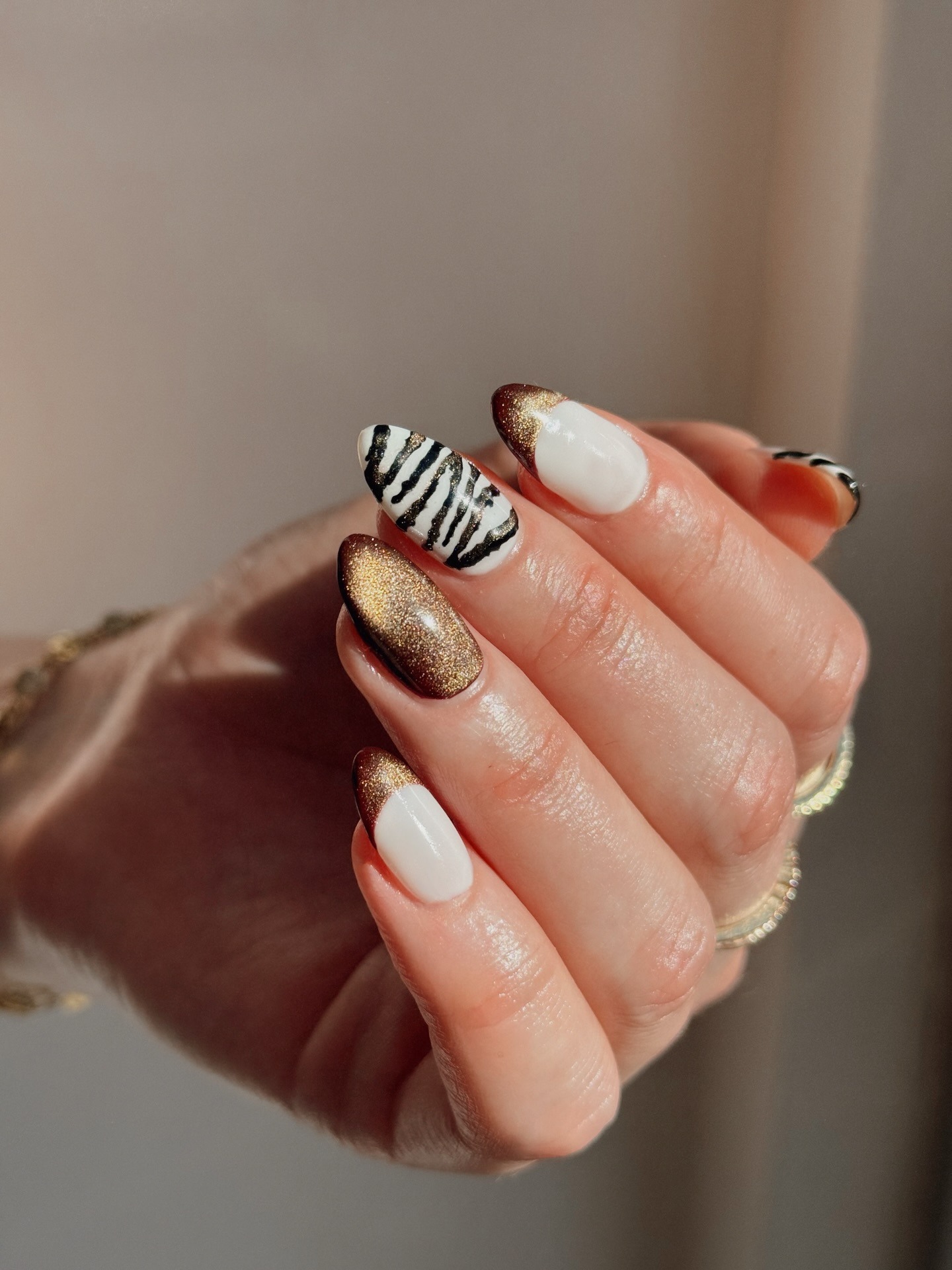 Velvet manicure with zebra accent nail.