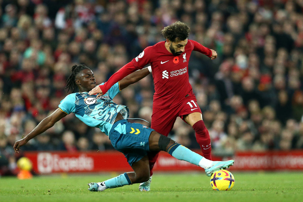 Mohamed Salah of Liverpool is challenged by Romeo Lavia of Southampton during the Premier League match between Liverpool FC and Southampton FC at Anfield on November 12, 2022 in Liverpool, England.