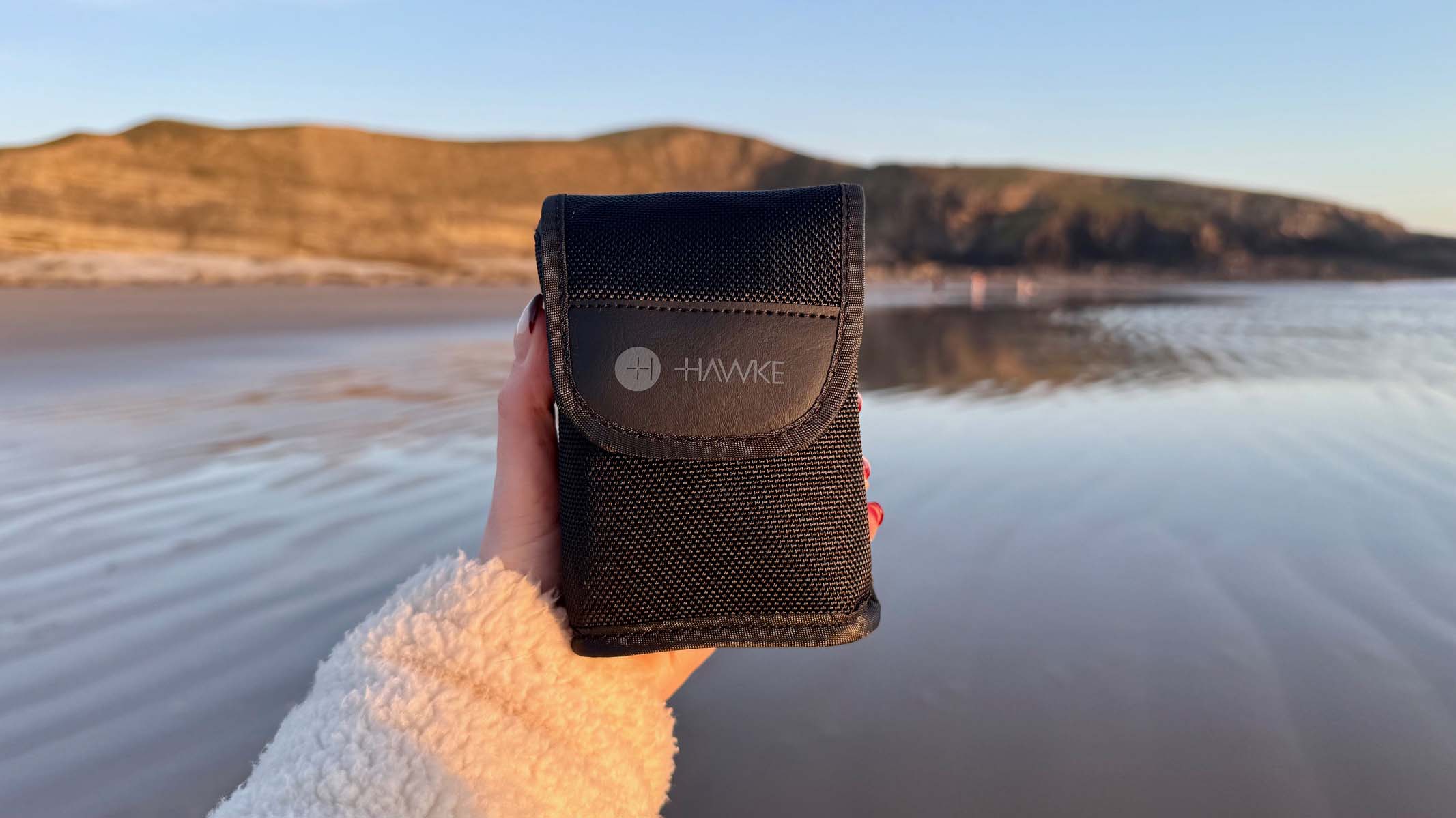 Hawke Endurance ED 8x25 in the hand at a coastal location