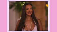 Maya Jama dress: Maya pictured wearing a white dress/co-ord and smiling while in the Love Island 2023 villa/ in a pink template