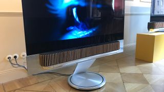 Beosound Explore soundbar and stand, in a living room