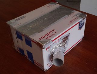 The completed, light-sealed spectrometer. Insert tube into oval, then use aluminum tape or foil to seal up any part of the box where light can enter.