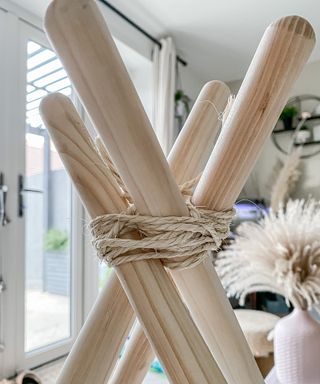 broom handles tied together with string