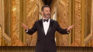 Jimmy Kimmel Hosting 2024's 96th Oscars Ceremony onstage in a tux