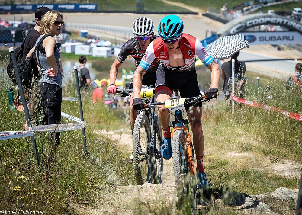Keegan Swenson (Stans-Pivot) climbing ahead of Alex Wild