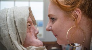 University of Dundee forensic art student Karen Fleming looks at a facial reconstruction she made of a Druid woman who lived during the Iron Age.