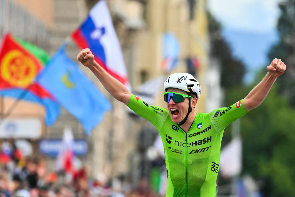 Slovenia&#039;s Tadej Pogacar celebrates as he crosses the finish line to win the men&#039;s Elite Road Race cycling event during the UCI 2024 Road World Championships, in Zurich, on September 29, 2024. (Photo by Fabrice COFFRINI / AFP)