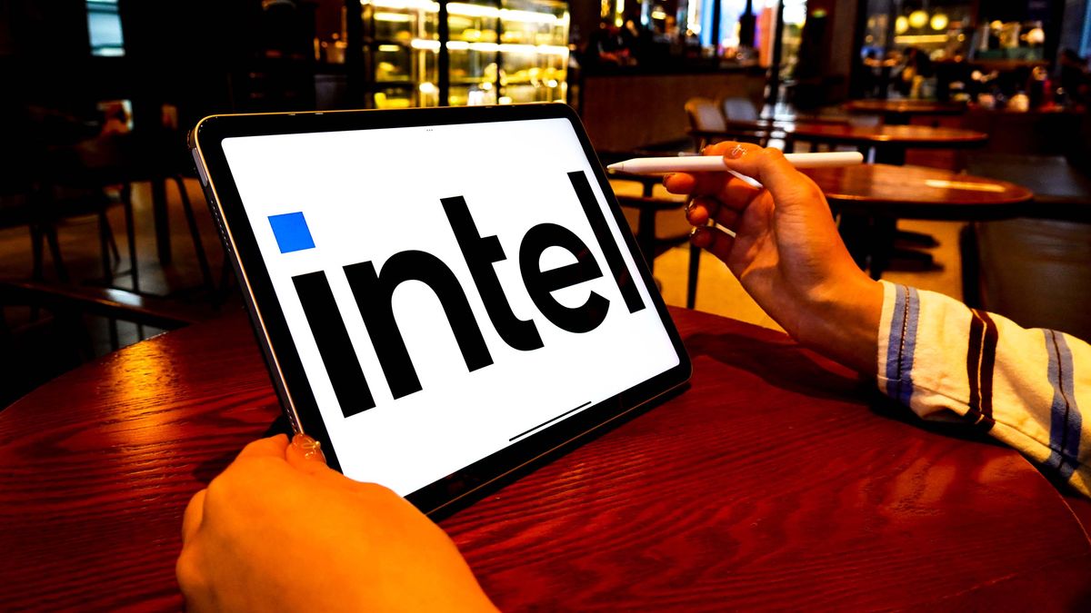 The Intel logo is displayed on the screen of an iPad. 