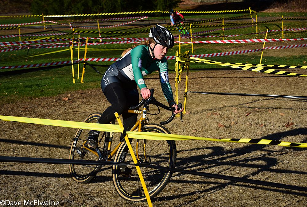 Libby White (House Industries) riding the zig-zag course on the lower grass field with two laps remaining