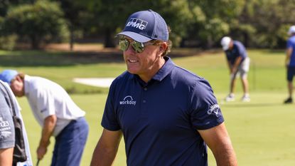Phil Mickelson walks off the green in golf tournement
