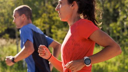 best running watch: women and men running outdoorw wearing the Coros Pace 3 running watch