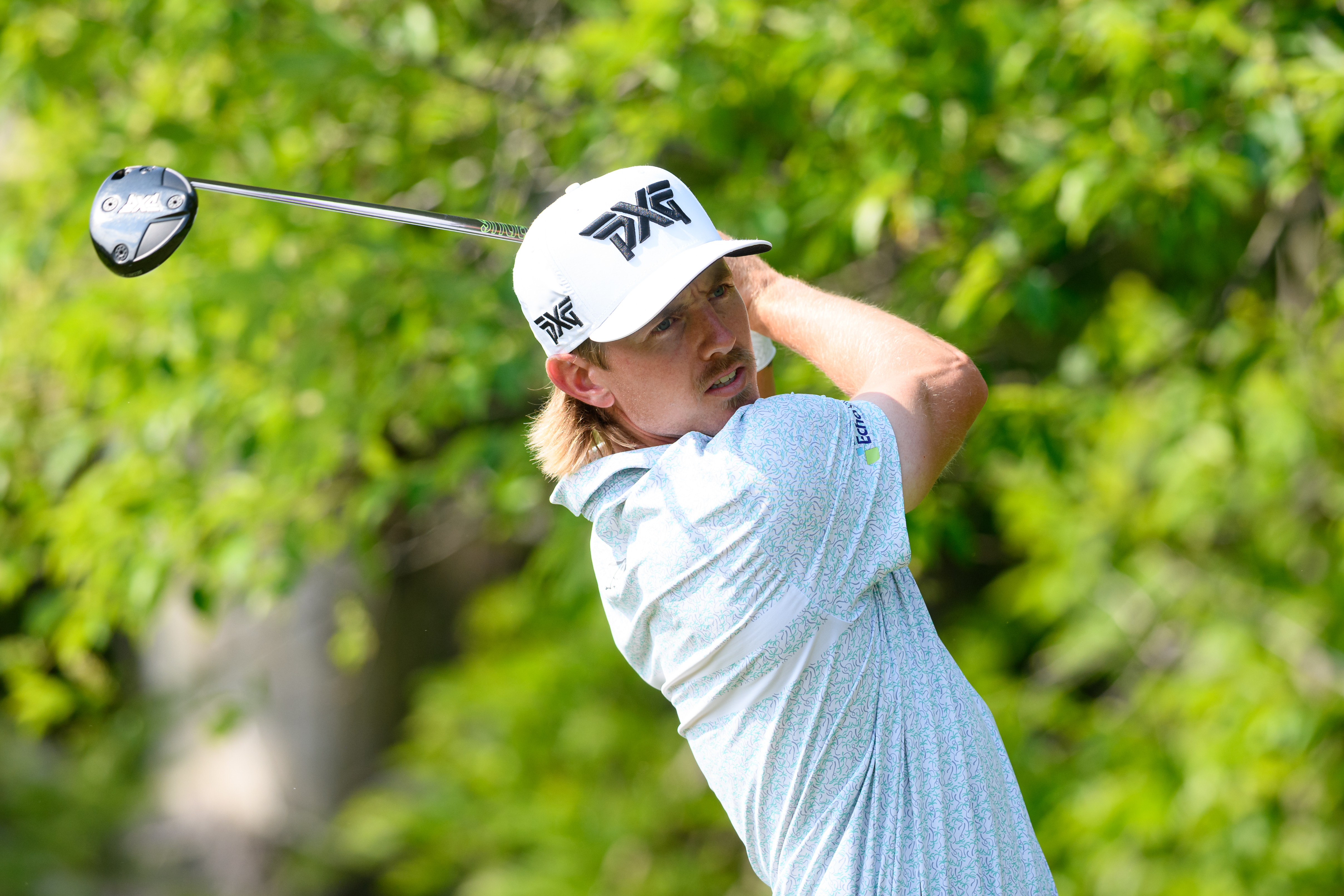 Jake Knapp hits a tee shot and watches its flight