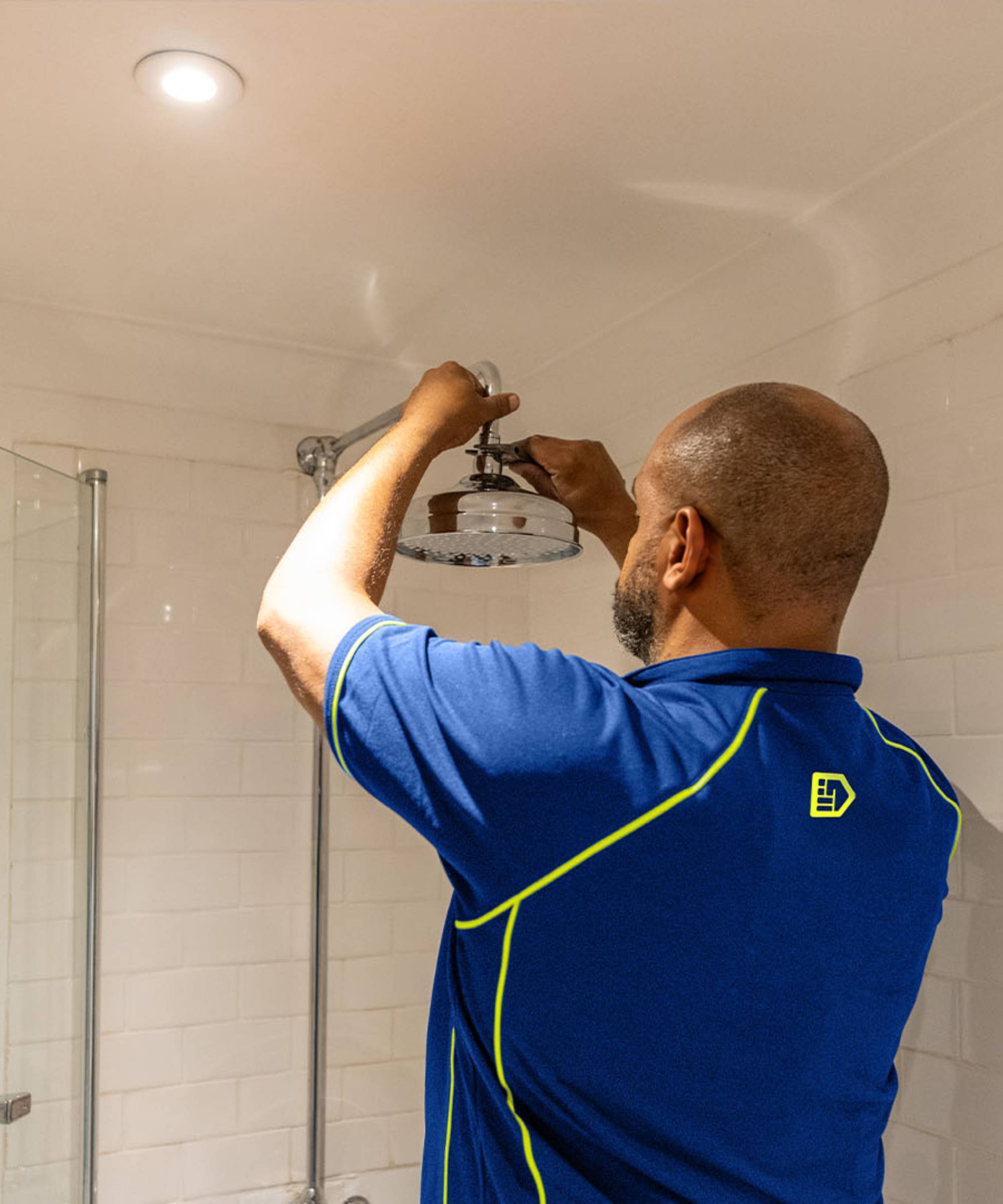 Engineer fixing a new shower head