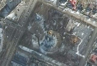 This image, captured by Maxar Technologies' WorldView-3 satellite on March 10, 2022, shows the initial excavation of a mass grave (center right) in the Ukrainian town of Bucha.