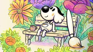 The Chicory protagonist (a dog) sat on a bench next to a large paintbrush while surrounded by flowers