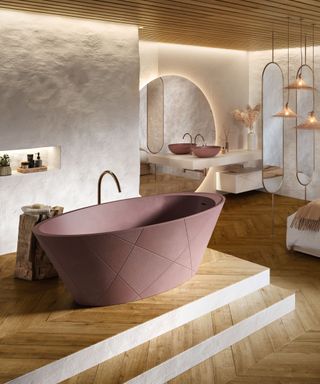 Open plan master suit with striking oval bathtub on raised wooden platform, textured white painted walls, large rounded mirror in background, two floor to ceiling oval mirrors, paneled wooden ceiling, wooden flooring, matching sink to bath