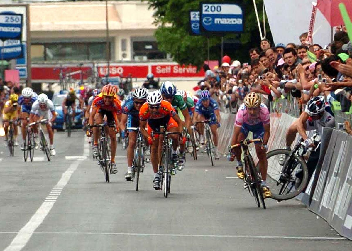 Paolo Bettini puts Baden Cooke into the barriers at the 2005 Giro