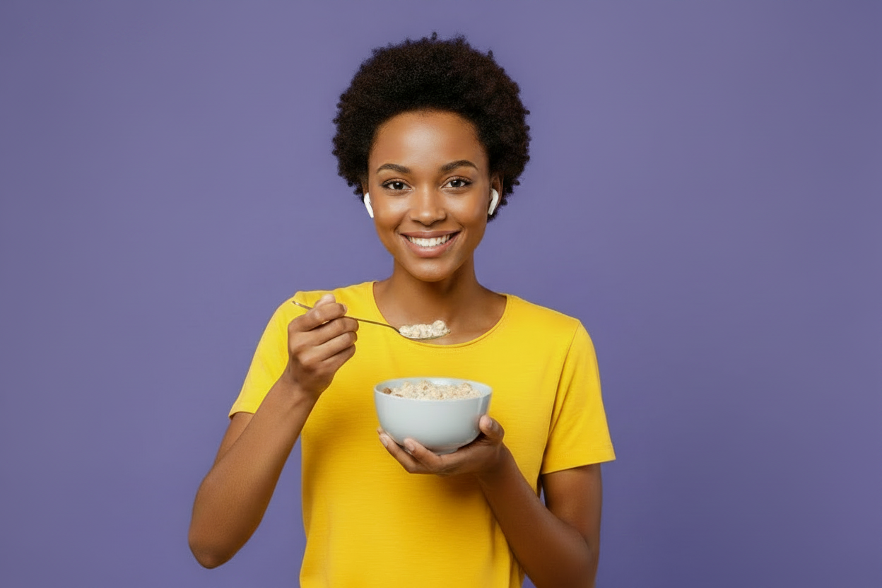 A person eating cereal against a color background