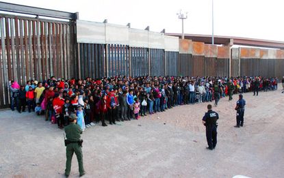 U.S. Customs and Border Protection guards large group of migrants in El Paso