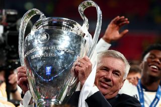 Real Madrid manager Carlo Ancelotti lifts the Champions League trophy following his side's victory over Borussia Dortmund in the 2024 final at Wembley Stadium in London, England