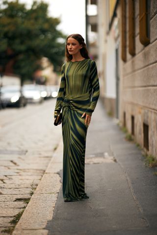 woman in long sleeve green dress