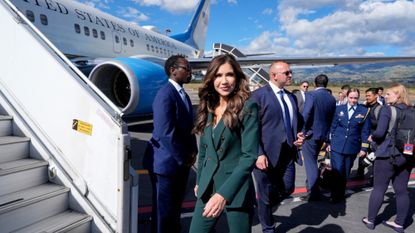 Then-Homeland Security Secretary Kristi Noem boards a plane in Ecuador in 2025.