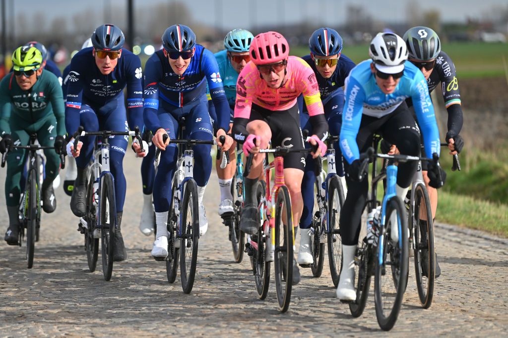 NINOVE BELGIUM FEBRUARY 24 LR Stefan Kung of Switzerland and Lewis Askey of Great Britain and Team GroupamaFDJ compete during the 79th Omloop Het Nieuwsblad 2024 Mens Elite a 2022km one day race from Ghent to Ninove UCIWT on February 24 2024 in Ninove Belgium Photo by Luc ClaessenGetty Images