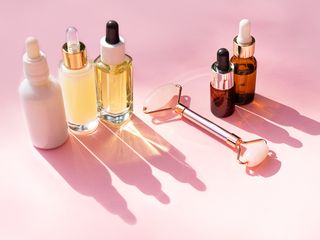 photograph of skincare taken against pink background