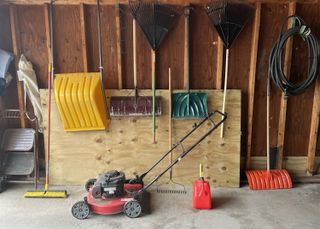 lawn mower stored in a garage