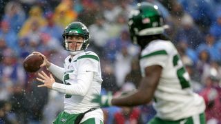 Mike White #5 throws a pass to Zonovan Knight #27 of the New York Jets in the third quarter of a game against the Buffalo Bills at Highmark Stadium on December 11, 2022 in Orchard Park, New York.