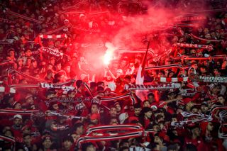 Wydad Casablanca fans lights flares ahead of a match against MAS Fez in January 2023.