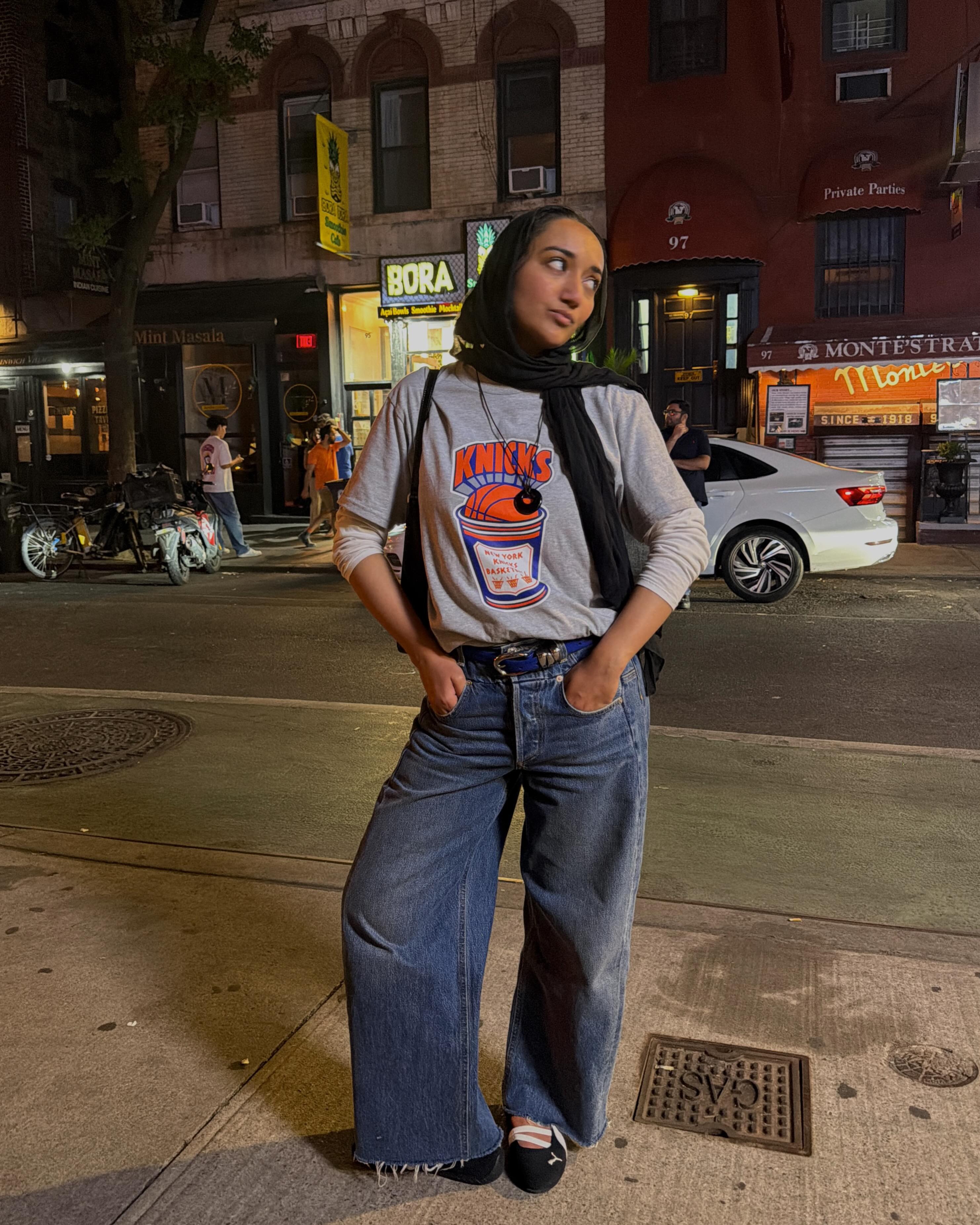 Woman wearing barrel leg jeans.
