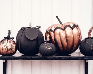 painted pumpkins on a table