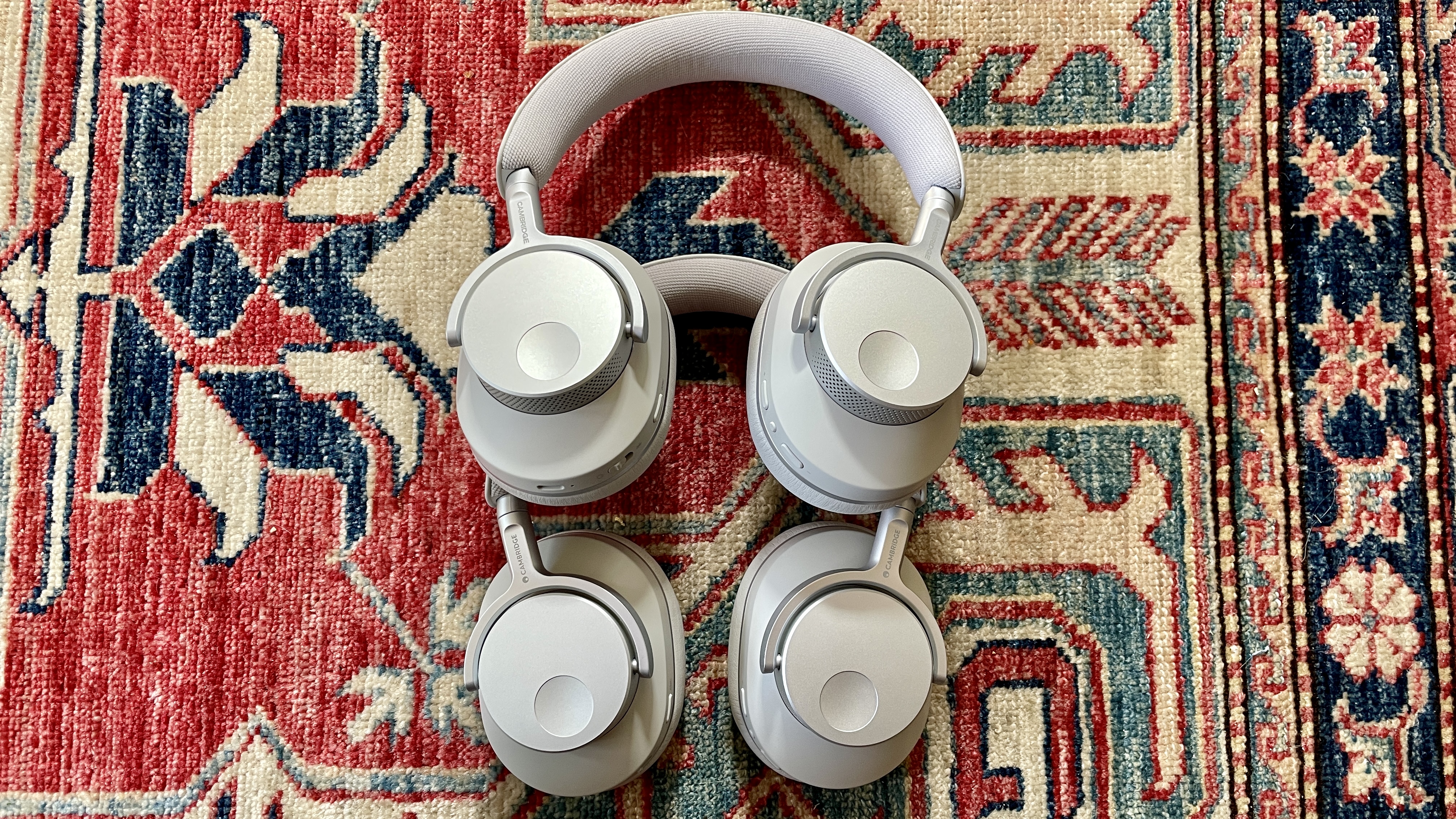 Cambridge Audio Melomania P100 SE with the original P100, either worn by Becky Scarrott or next to each other, to illustrate the similarities
