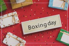 Boxing day sale , wooden letters and gift box on white rustic wooden background