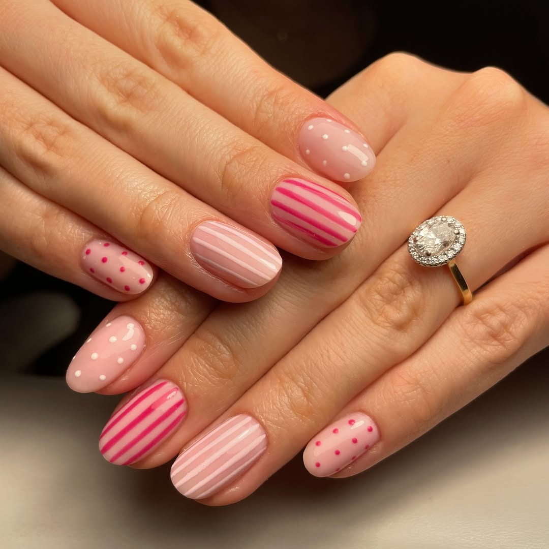 pink polka dot and striped nails with white and red polka dots