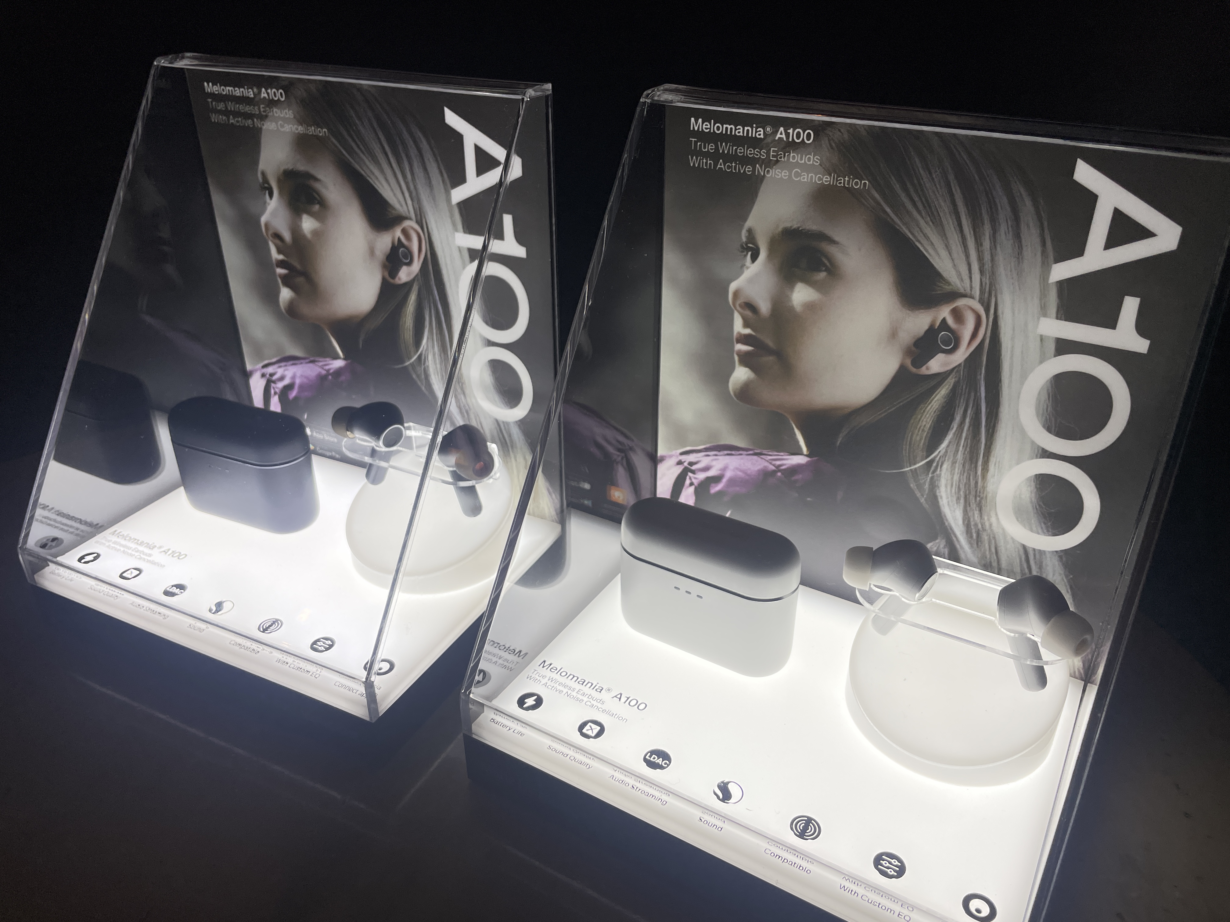 Cambridge Audio A100 earbuds in two different finishes in display case