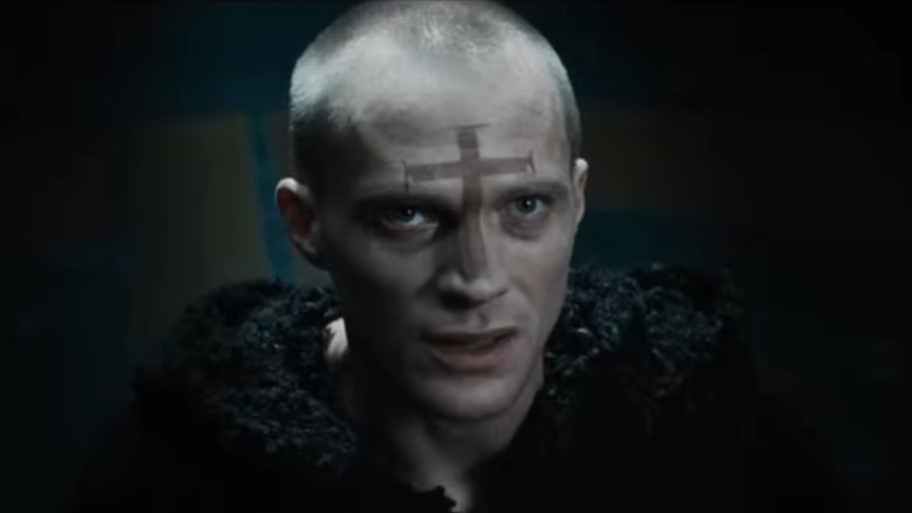 Paul Bettany with a cross on his face in Priest