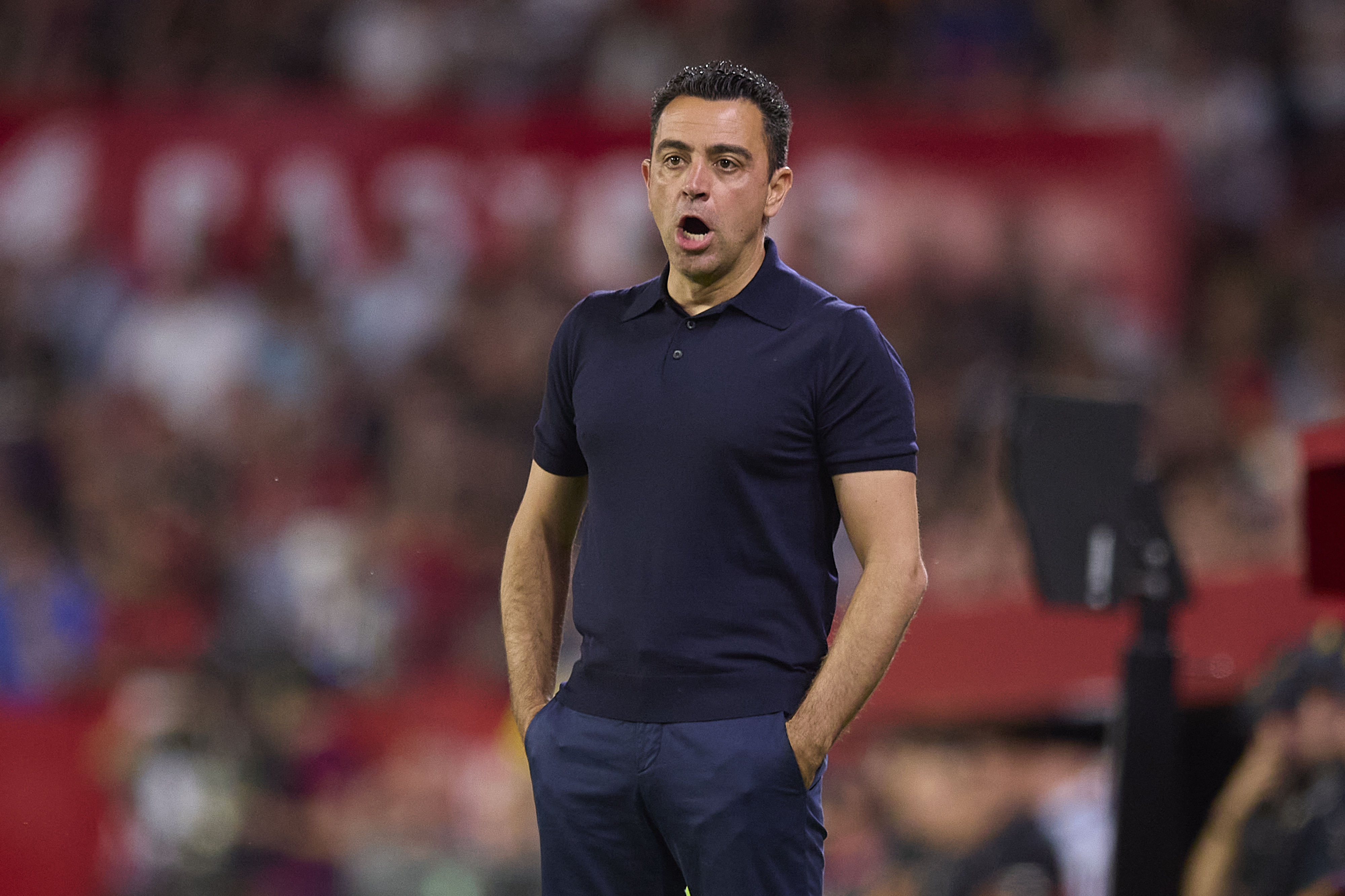 SEVILLE, SPAIN - MAY 26: Xavi, Head Coach of FC Barcelona, looks on during the LaLiga EA Sports match between Sevilla FC and FC Barcelona at Estadio Ramon Sanchez Pizjuan on May 26, 2024 in Seville, Spain. (Photo by Fran Santiago/Getty Images)