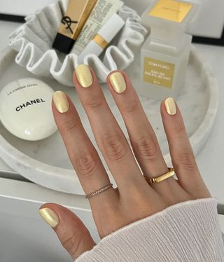 Gold nail polish design.