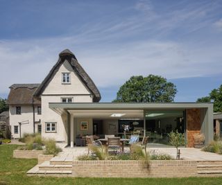 A thatched period cottage with contemporary glazed extension