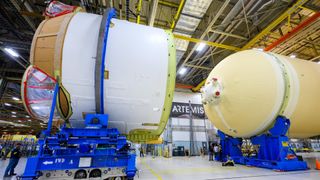 Technicians at NASA’s Michoud Assembly Facility in New Orleans move the engine section of NASA’s Space Launch System rocket for Artemis 2.