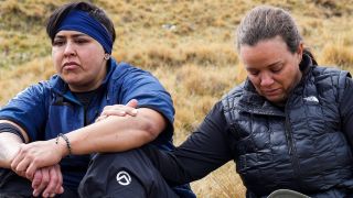 Pati and Amy look upset while sitting on the ground