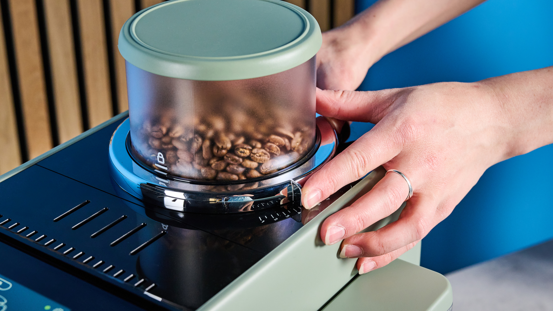 the de'longhi rivelia automatic superautomatic coffee machine in sage green with a bright LED screen, two interchangeable bean hoppers, an automatic milk frother, and a huge range of coffee recipes