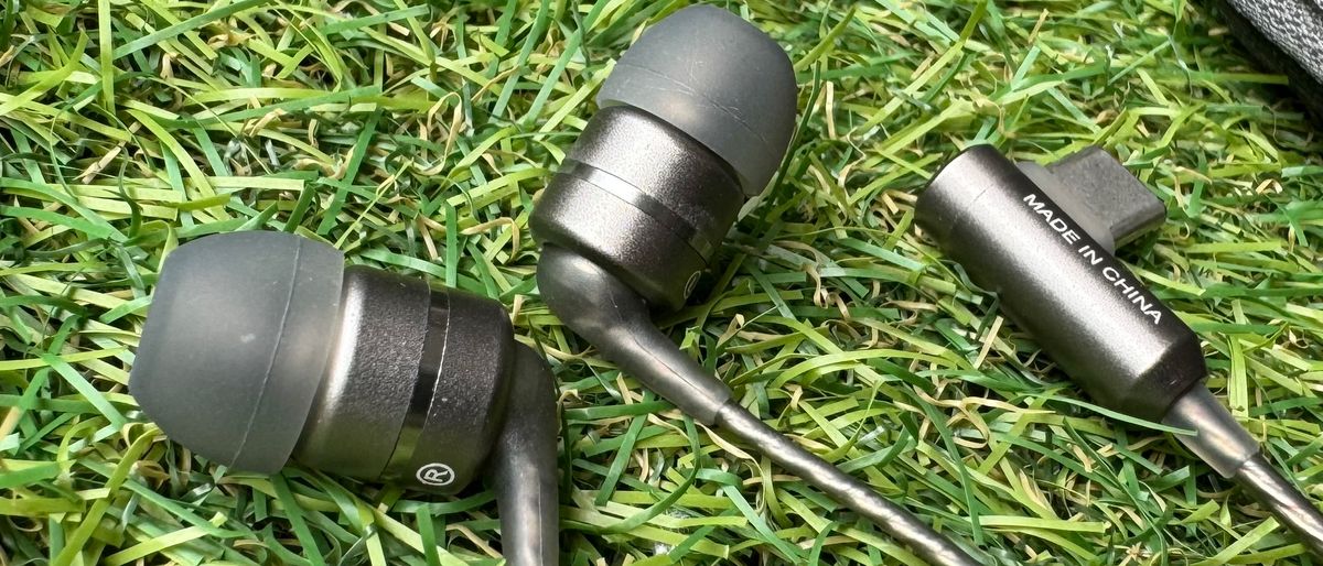 SoundMagic E80D wired USB-C hedaphones on grass and mosaic