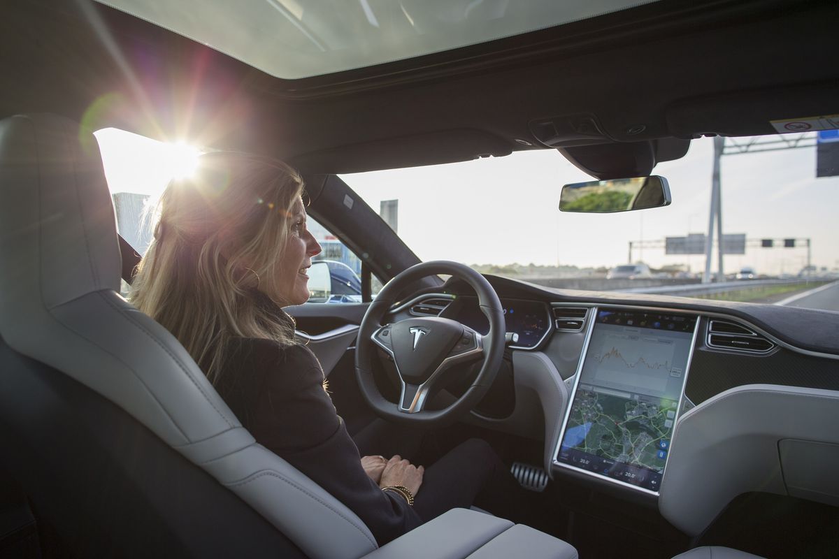 An employee drives a Tesla Motors Inc. Model S electric automobile, equipped with Autopilot hardware and software, hands-free on a highway in Amsterdam, Netherlands, on Monday, Oct. 26, 2015. 