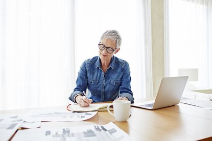 Senior woman working at her desk